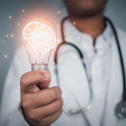 doctor holding lightbulb